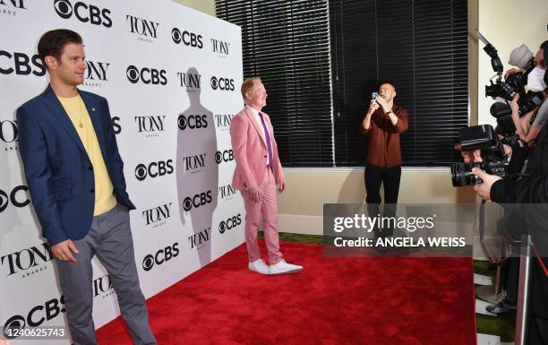 Jesse Williams takes pictures of Michael Oberholtzer and Jesse Tyler Ferguson on the red carpet as they attend the 2022 Tony Awards Meet The Nominees...