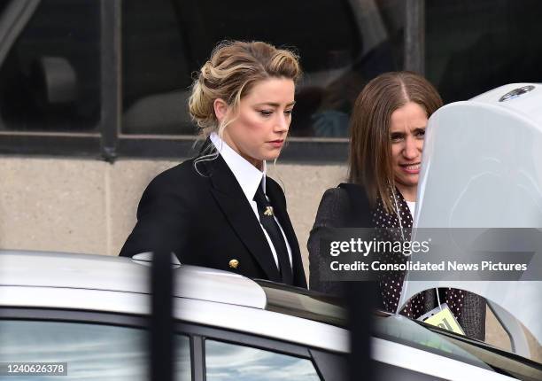 Amber Heard arrives for her trial outside court during the Johnny Depp and Amber Heard civil trial at Fairfax County Circuit Court on April 13, 2022...