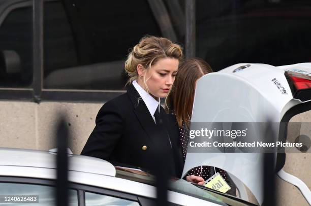 Amber Heard arrives for her trial outside court during the Johnny Depp and Amber Heard civil trial at Fairfax County Circuit Court on April 13, 2022...