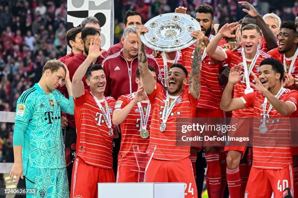 Corentin Tolisso of Bayern Muenchen with championship trophy after the Bundesliga match between FC Bayern München and VfB Stuttgart at Allianz Arena...