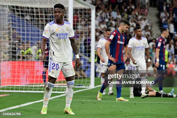 Real Madrid's Brazilian forward Vinicius Junior celebrates scoring his team's fourth goal during the Spanish league football match between Real...