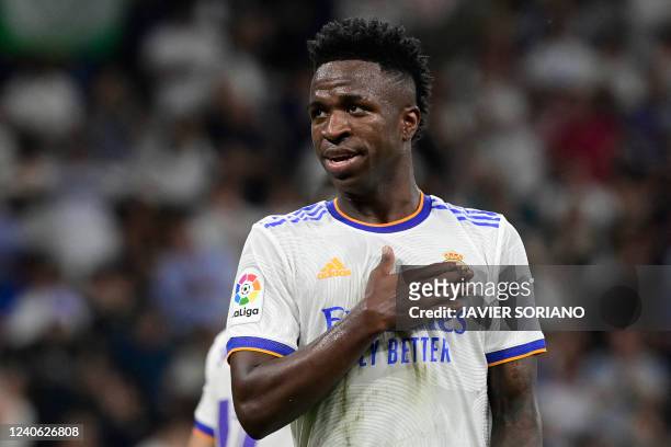 Real Madrid's Brazilian forward Vinicius Junior celebrates scoring his team's fourth goal during the Spanish league football match between Real...