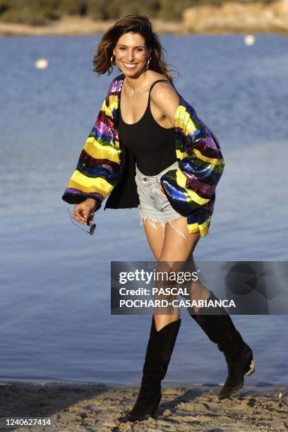 Former Miss France Laury Thilleman poses before the Etam swimsuit collection at the Domaine de Murtoli in Sartene, on the French Mediterranean island...