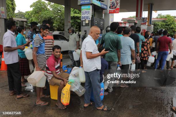 Sri Lankans queue up to obtain kerosene oil at a fuel station in Colombo, Sri Lanka, 12 May 2022. With the island nation experiencing a severe...