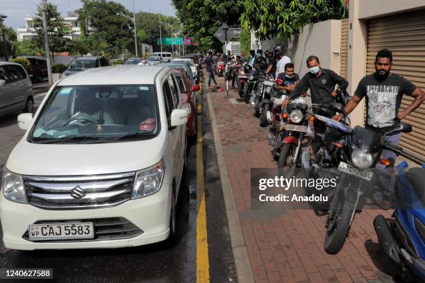 Sri Lankan queue up to obtain petrol at a fuel station in Colombo, Sri Lanka, 12 May 2022. With the island nation experiencing a severe shortage of...