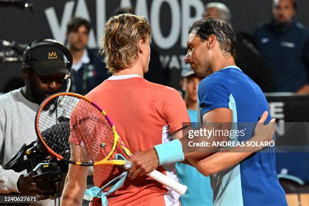 Canada's Denis Shapovalov and Spain's Rafael Nadal greet after Shapovalov won their third round match at the ATP Rome Open tennis tournament on May...