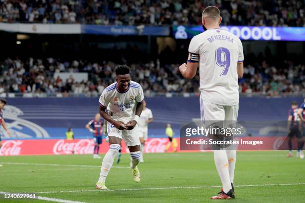 Vinicius Junior of Real Madrid celebrates 5-0 with Karim Benzema of Real Madrid during the La Liga Santander match between Real Madrid v Levante at...