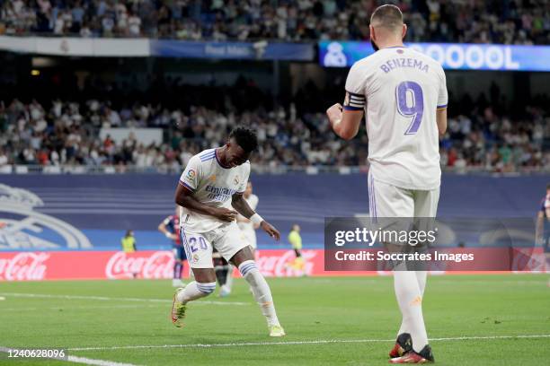 Vinicius Junior of Real Madrid celebrates 5-0 with Karim Benzema of Real Madrid during the La Liga Santander match between Real Madrid v Levante at...