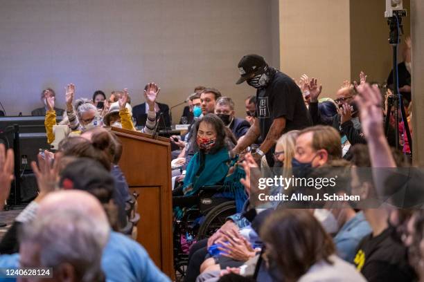 Costa Mesa, CA Attendees show their approval with hands in the air as Gloria Arellanes, Tongva elder, finishes her speech at the California Coastal...