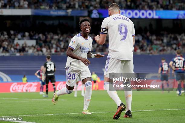 Vinicius Junior of Real Madrid, celebrates 5-0 with Karim Benzema of Real Madrid during the La Liga Santander match between Real Madrid v Levante at...