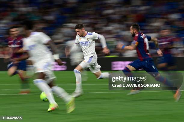 Real Madrid's Uruguayan midfielder Federico Valverde runs during the Spanish league football match between Real Madrid CF and Levante UD at the...