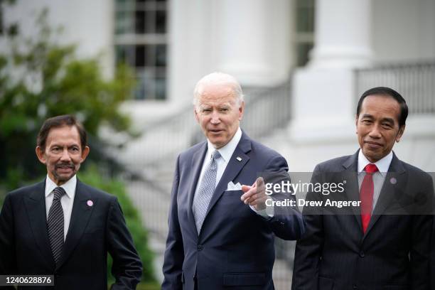 Flanked by Sultan of Brunei Haji Hassanal Bolkiah and President of Indonesia Joko Widodo , U.S. President Joe Biden reacts to a reporters question...
