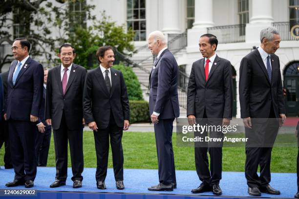 President Joe Biden talks with Sultan of Brunei Haji Hassanal Bolkiah during a family photo for the U.S.-ASEAN Special Summit on the South Lawn of...