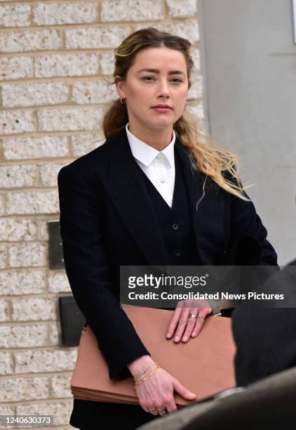 Amber Heard departs following the recess for the day outside court during the Johnny Depp and Amber Heard civil trial at Fairfax County Circuit Court...