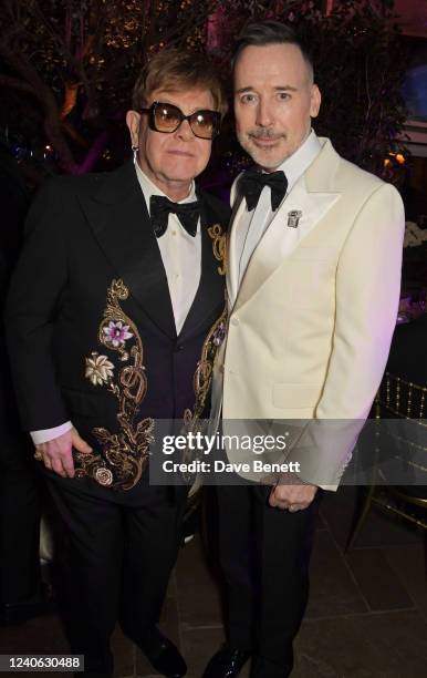 Sir Elton John and David Furnish attend a special event hosted by The Caring Family Foundation to benefit the Elton John AIDS Foundation at Annabel's...