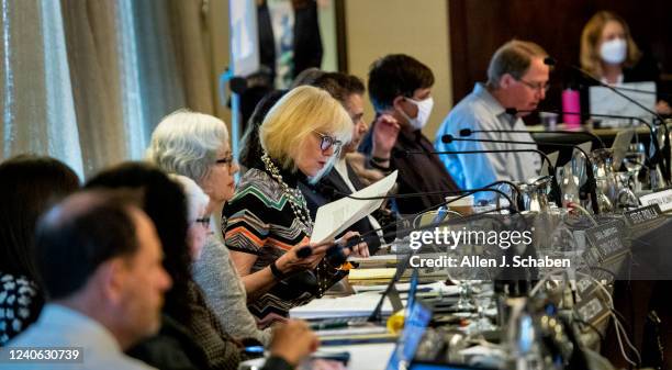 Costa Mesa, CA Dayna Bochco, California Coastal Commission commissioner, center, joins fellow commissioners as they listen to remarks at the...