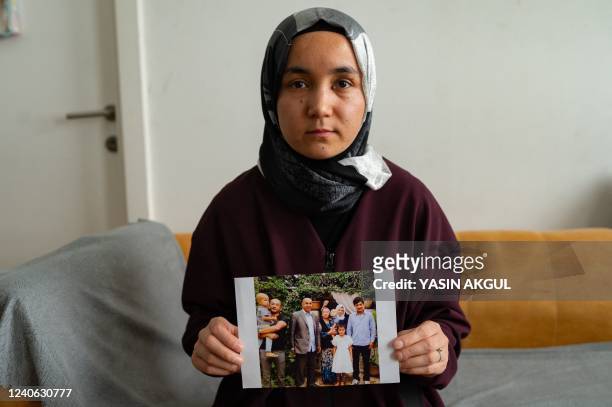 In this photograph taken on March 12 Uyghur rights activist Nursimangul Abdureshid poses during an interview with AFP in Istanbul. - A Uyghur woman...