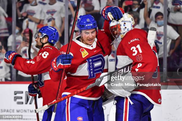 Corey Schueneman of the Laval Rocket and goaltender Cayden Primeau celebrate their victory against the Syracuse Crunch in Game Three of the North...