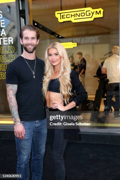 Andre Hamann and Pamela Reif attend the grand opening of the new Technogym store on May 12, 2022 in Munich, Germany.