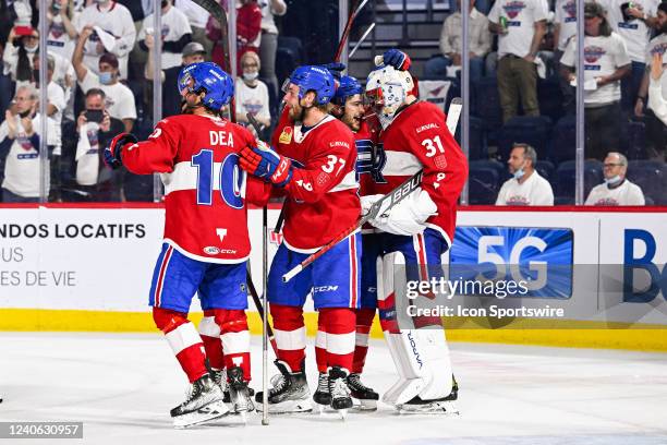 Laval Rocket goalie Cayden Primeau celebrates the win with his teammates during the game 3 of round 2 of the Calder Cup Playoffs between the Syracuse...