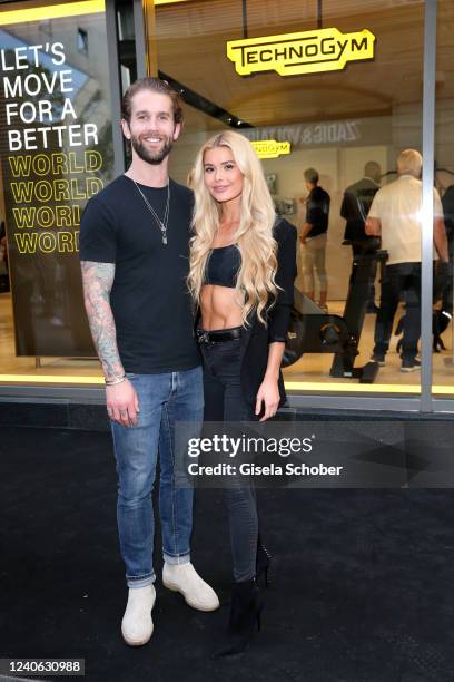 Andre Hamann and Pamela Reif attend the grand opening of the new Technogym store on May 12, 2022 in Munich, Germany.