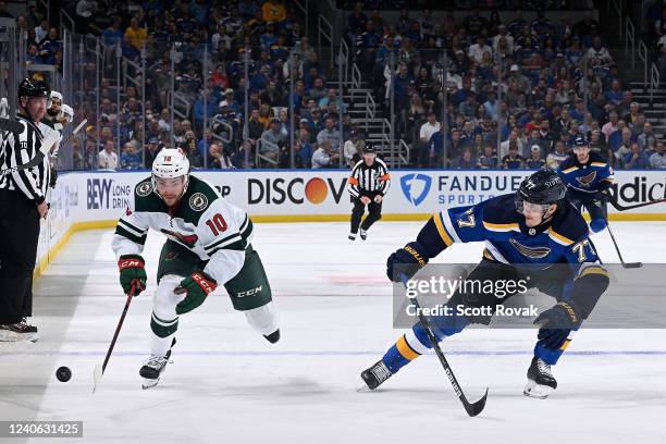 Tyson Jost of the Minnesota Wild goes after the puck as Niko Mikkola of the St. Louis Blues defends in Game Six of the First Round of the 2022...