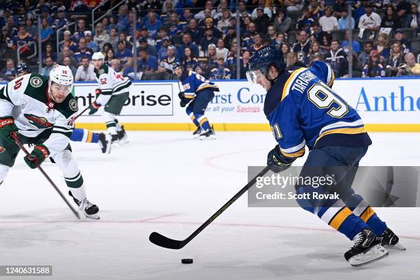 Vladimir Tarasenko of the St. Louis Blues controls the puck as Tyson Jost of the Minnesota Wild pressures in Game Six of the First Round of the 2022...