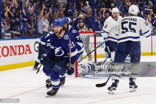 Brayden Point of the Tampa Bay Lightning celebrates the game winning goal against goalie Jack Campbell of the Toronto Maple Leafs during overtime in...