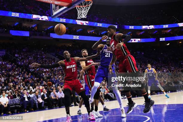 Joel Embiid of Philadelphia 76ers and Bam Adebayo , Max Strus, Jimmy Butler of Miami Heat in action during NBA semifinals between Philadelphia 76ers...