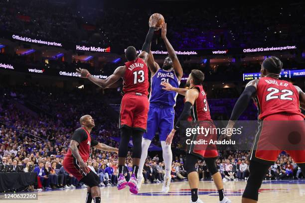 Joel Embiid of Philadelphia 76ers and Max Strus, Bam Adebayo, Jimmy Butler of Miami Heat in action during NBA semifinals between Philadelphia 76ers...