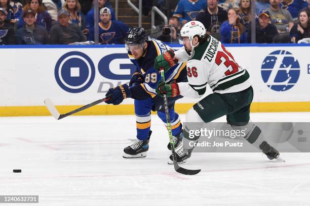 Mats Zuccarello of the Minnesota Wild defends against Pavel Buchnevich of the St. Louis Blues in Game Six of the First Round of the 2022 Stanley Cup...