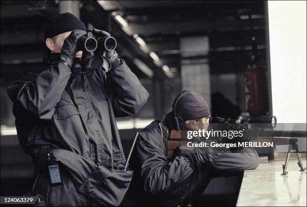 French National SWAT team: RAID In France On January 20, 1998 - French national SWAT team sharpshooter keeps close watch over the facades of Val...