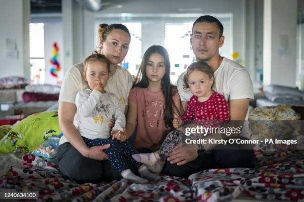Ukrainian refugees Elena Sidorova her husband Vladimir Sidorova and their daughters Polina , aged 9, and twins Eva and Zlata , aged 2, who fled their...