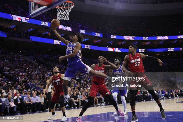 Tyrese Maxey, Joel Embiid of Philadelphia 76ers and Jimmy Butler , Bam Adebayo , Max Strus of Miami Heat in action during NBA semifinals between...