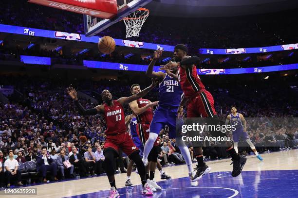 Joel Embiid of Philadelphia 76ers and Jimmy Butler , Bam Adebayo , Max Strus of Miami Heat in action during NBA semifinals between Philadelphia 76ers...