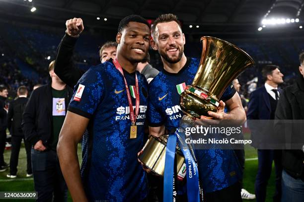 Denzel Dumfries and Stefan de Vrij of FC Internazionale pose with the trophy during the award ceremony at the end of the Coppa Italia final football...