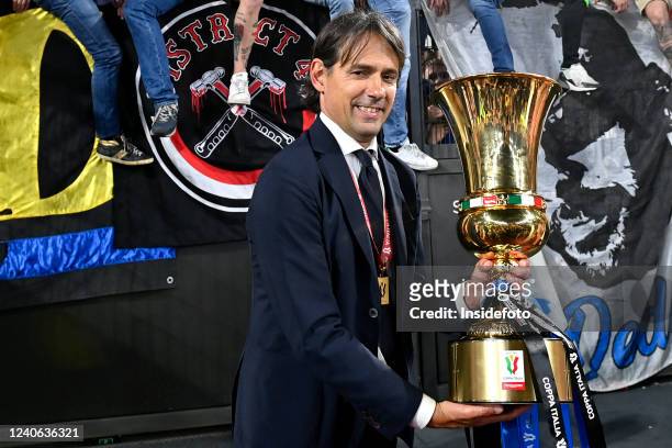 Simone Inzaghi coach of FC Internazionale holds the trophy at the end of the Italy Cup final football match between Juventus FC and FC...