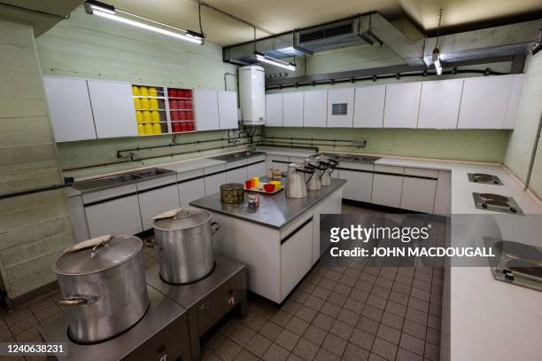 This picture shows the kitchen in the Pankstrasse nuclear fallout shelter in Berlin on May 10, 2022. - Built in 1977 during the Cold War, this...