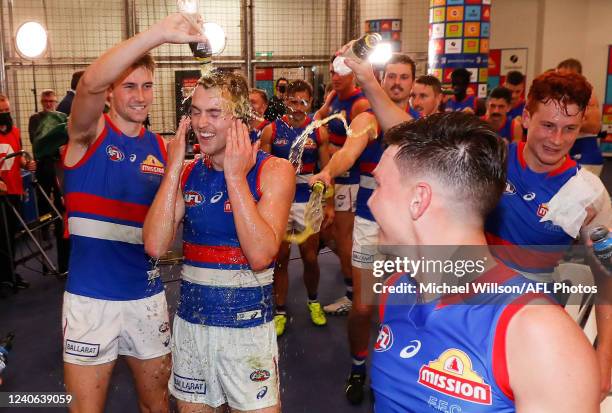 Debutant, Luke Cleary of the Bulldogs celebrates with teammates during the 2022 AFL Round 09 match between the Collingwood Magpies and the Western...