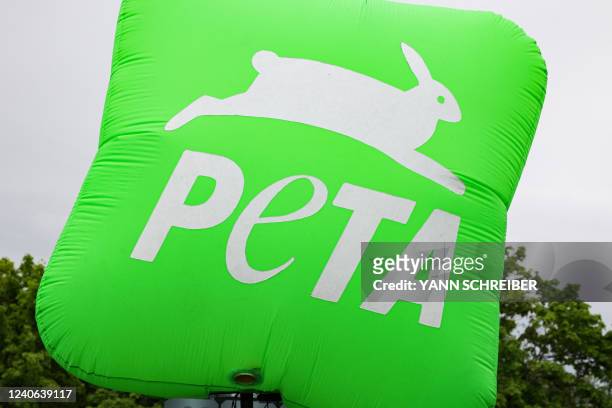 The logo of the international non-governmental animal rights organisation People for the Ethical Treatment of Animals is pictured during a protest on...