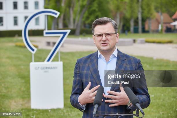Ukraine's Foreign Minister Dmytro Kuleba gives a press statement during the G7 Foreign Ministers meeting in Wangels, northern Germany, on May 13,...