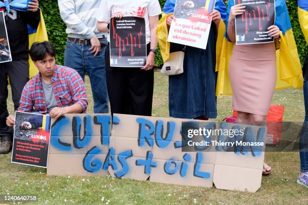 Ukrainians demonstrate in front of the Lukoil Headquarters on May 13, 2022 in Vilvoorde, Belgium. In the first two months of the war in Ukraine,...