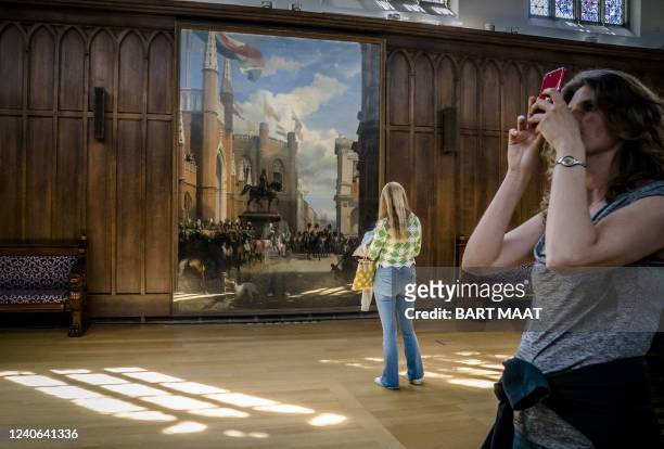 People visit the Kneuterdijk Palace where guided tours through the former residence of King Willem II are organised on May 13, 2022. - The palace was...