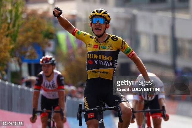 Team Jumbo's Dutch rider Koen Bouwman celebrates as he crosses the finish line to win the 7th stage of the Giro d'Italia 2022 cycling race, 196...