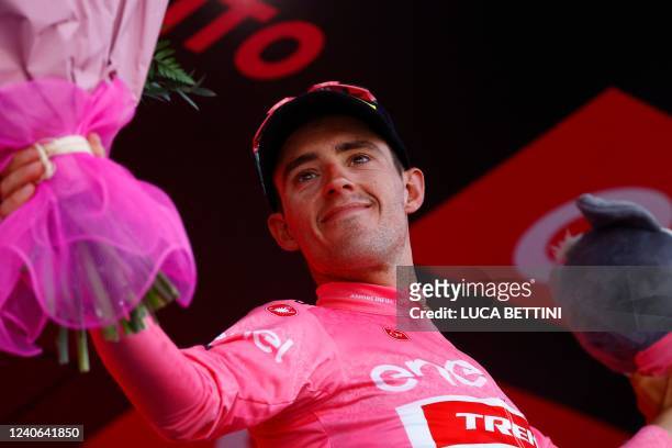 Overall leader Team Trek's Spanish rider Juan Pedro Lopez celebrates on the podium after the 7th stage of the Giro d'Italia 2022 cycling race, 196...