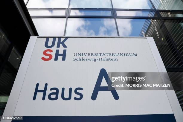 The logo of the Lubeck campus of the 'University Medical Center Schleswig-Holstein' hospital treating Ukrainian patients is pictured during a visti...