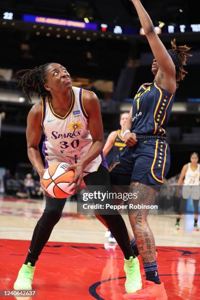 Nneka Ogwumike of the Los Angeles Sparks handles the ball. During the game against the Indiana Fever at Gainbridge Fieldhouse on May 8, 2022 in...