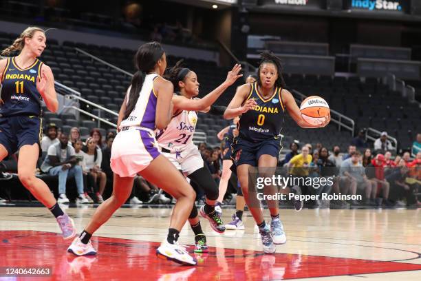 Kelsey Mitchell of the Indiana Fever handles the ball during the game against the Los Angeles Sparks at Gainbridge Fieldhouse on May 8, 2022 in...