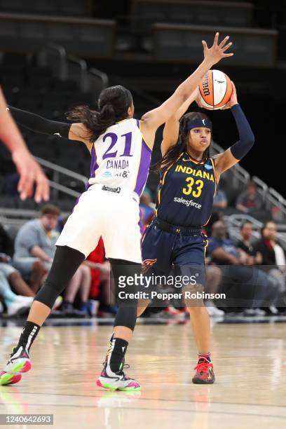 Destanni Henderson of the Indiana Fever handles the ball during the game against the Los Angeles Sparks at Gainbridge Fieldhouse on May 8, 2022 in...