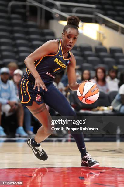 Kysre Gondrezick of the Indiana Fever handles the ball during the game against the Los Angeles Sparks at Gainbridge Fieldhouse on May 8, 2022 in...